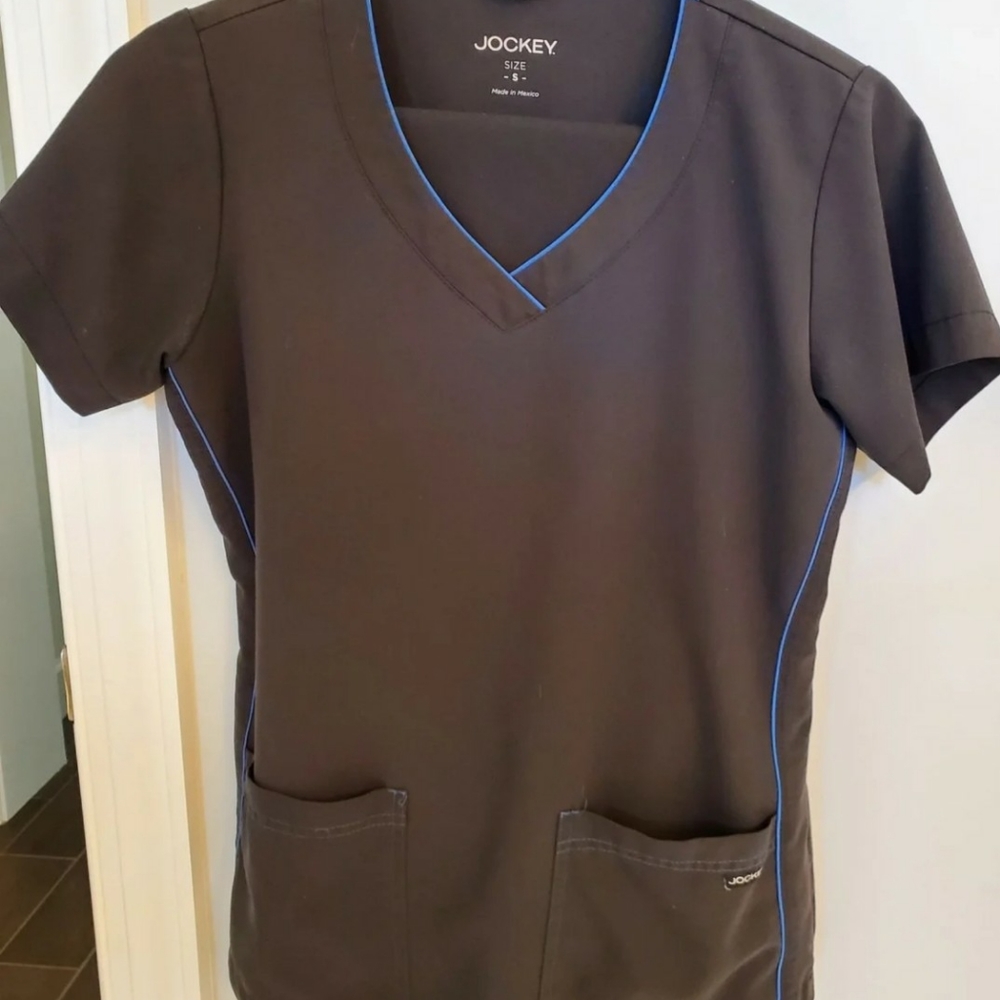 Two sets of black Jockey scrubs size small